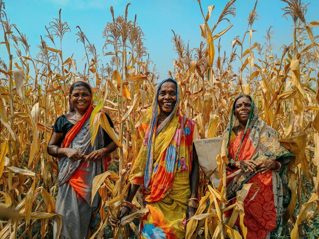 Women in Traditional Clothing on Field