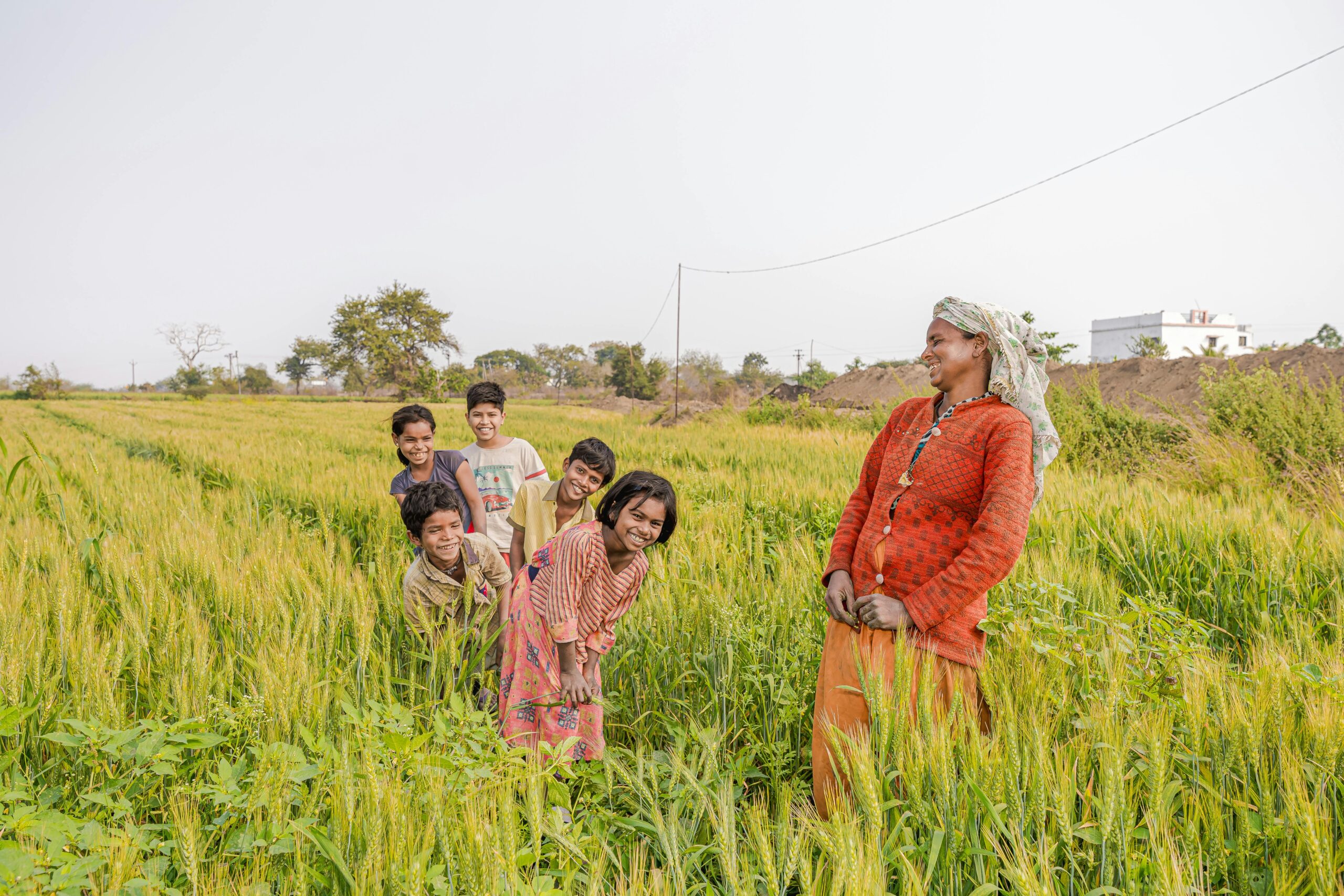 Woman with Kids in a Green Field